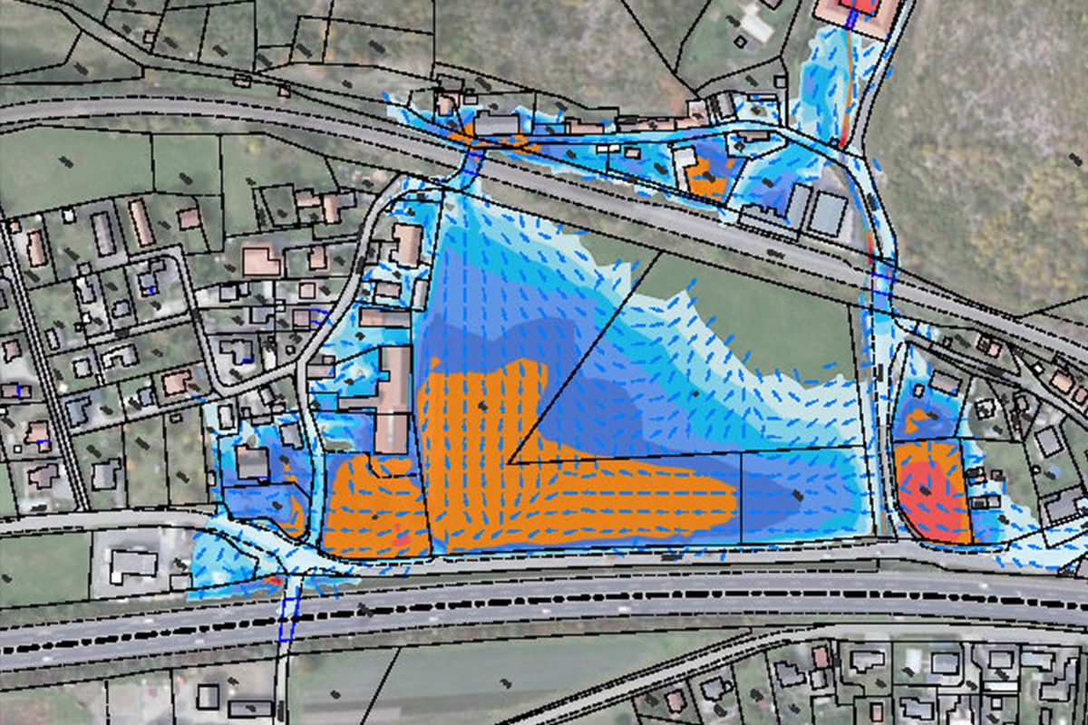The map shows a landscape with water lines, development plans and flow directions in bright colours.